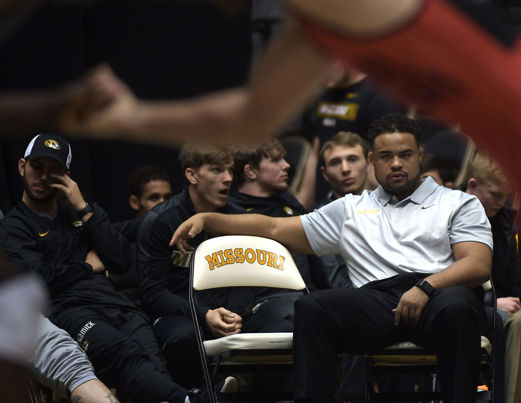 Dom Bradley watches a Missouri wrestling match